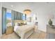 Bright bedroom with a comfortable bed and en-suite bathroom at 11414 Brightly Dr, Venice, FL 34293