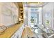 Modern home office with wood built-ins, window, and stylish decor at 11414 Brightly Dr, Venice, FL 34293