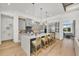 Modern kitchen with gray cabinets, quartz countertops, and a large island at 11414 Brightly Dr, Venice, FL 34293
