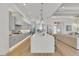 Eat-in kitchen with gray cabinets, white countertops, and a large island at 11414 Brightly Dr, Venice, FL 34293
