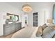 Light and airy bedroom with dresser and walk-in closet at 11414 Brightly Dr, Venice, FL 34293