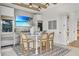 Modern wet bar with large TV and built in beverage cooler at 11414 Brightly Dr, Venice, FL 34293