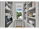 Butler's pantry with coffee bar featuring built-in espresso machine at 11414 Brightly Dr, Venice, FL 34293