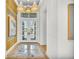 Bright entryway with hardwood floors and statement art at 11414 Brightly Dr, Venice, FL 34293