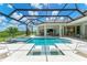 Inviting, refreshing pool with a covered patio and spa at 11414 Brightly Dr, Venice, FL 34293