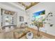 Living room with fireplace, large TV, and access to the entryway at 11414 Brightly Dr, Venice, FL 34293
