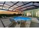 Inviting, refreshing pool with a covered patio and spa at 11414 Brightly Dr, Venice, FL 34293