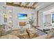 Open living room with hardwood floors, a fireplace, and access to a pool area at 11414 Brightly Dr, Venice, FL 34293