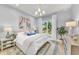 Spacious bedroom with large windows and ensuite bathroom at 11414 Brightly Dr, Venice, FL 34293