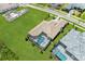 Aerial view of a home with a large pool and backyard at 11414 Brightly Dr, Venice, FL 34293
