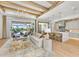 Open living space with kitchen, pool view, and light-filled living area at 11414 Brightly Dr, Venice, FL 34293