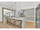 Modern kitchen with gray cabinets, white countertops, and a spacious island at 11414 Brightly Dr, Venice, FL 34293