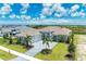 Luxury home with stone accents and palm trees at 11414 Brightly Dr, Venice, FL 34293