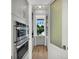 Well-equipped butler's pantry with stainless steel appliances and ample storage at 11414 Brightly Dr, Venice, FL 34293