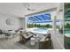 Relaxing pool and patio area with covered lanai, spa, and outdoor seating at 11414 Brightly Dr, Venice, FL 34293