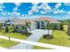 Luxury home with paver driveway and lush landscaping at 11414 Brightly Dr, Venice, FL 34293