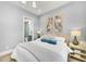 Serene bedroom with ensuite bathroom and window views at 11414 Brightly Dr, Venice, FL 34293