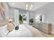 Bright bedroom with ensuite bathroom and window views at 11414 Brightly Dr, Venice, FL 34293