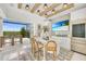 Wet bar with TV, wine storage, and outdoor access at 11414 Brightly Dr, Venice, FL 34293