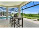 Enjoy the screened patio with outdoor seating and pool view at 11414 Brightly Dr, Venice, FL 34293