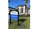 Modern home exterior with landscaping and signage at 1158 Blue Shell Loop, Sarasota, FL 34240