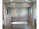 Luxurious bathroom with freestanding tub and large walk-in shower at 1158 Blue Shell Loop, Sarasota, FL 34240