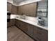 Well-equipped kitchen with contemporary cabinetry and a built-in espresso machine at 1158 Blue Shell Loop, Sarasota, FL 34240