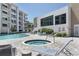 Relaxing pool and spa area with lounge chairs at 1703 N Tamiami Trl # 504, Sarasota, FL 34234