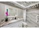 Spa-like bathroom with marble shower and granite vanity at 3500 El Conquistador Pkwy # 339, Bradenton, FL 34210