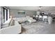 Open living space with sectional sofa and kitchen bar at 3500 El Conquistador Pkwy # 339, Bradenton, FL 34210
