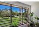 Relaxing screened balcony overlooking lush landscaping and a pool at 3500 El Conquistador Pkwy # 339, Bradenton, FL 34210