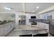 Spacious kitchen with island, granite counters & white cabinets at 3500 El Conquistador Pkwy # 339, Bradenton, FL 34210