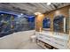 Spa-like bathroom with blue marble walls, double vanity, and walk-in shower at 3500 El Conquistador Pkwy # 339, Bradenton, FL 34210