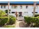 Attractive entryway with lush landscaping and a welcoming gate at 3500 El Conquistador Pkwy # 339, Bradenton, FL 34210