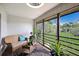 Comfortable screened patio with wicker furniture, offering a peaceful outdoor space at 3500 El Conquistador Pkwy # 339, Bradenton, FL 34210