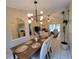 Elegant dining room with a modern chandelier and wood table at 4190 Arrow Ave, Sarasota, FL 34232