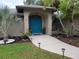 Bright teal front door and walkway at 4190 Arrow Ave, Sarasota, FL 34232