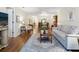 Open living area with hardwood floors, sofa, and view to the dining area at 4427 Longmeadow # 48, Sarasota, FL 34235
