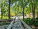 Community pool with a nearby bathhouse and tranquil wooded setting at 4427 Longmeadow # 48, Sarasota, FL 34235