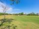 Expansive green golf course with sand traps and trees at 4427 Longmeadow # 48, Sarasota, FL 34235