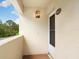 Condo entryway with a screen door and light fixture at 4427 Longmeadow # 48, Sarasota, FL 34235