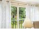 Peaceful view of lush green landscaping from a condo window at 4427 Longmeadow # 48, Sarasota, FL 34235