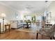 Bright living room with hardwood floors, comfy seating, and access to a balcony at 4427 Longmeadow # 48, Sarasota, FL 34235