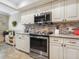 Modern kitchen with stainless steel appliances and granite countertops at 4427 Longmeadow # 48, Sarasota, FL 34235
