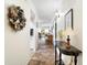 Bright entryway with view to living room and kitchen at 4427 Longmeadow # 48, Sarasota, FL 34235