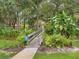 Scenic walkway leading to the community pool and clubhouse at 4427 Longmeadow # 48, Sarasota, FL 34235