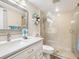 Clean bathroom with updated vanity and a large walk-in shower at 4427 Longmeadow # 48, Sarasota, FL 34235