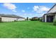 Expansive backyard with green lawn and privacy at 15425 White Linen Dr, Bradenton, FL 34211