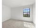 Spacious bedroom with large window and plush carpeting at 15425 White Linen Dr, Bradenton, FL 34211