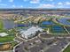 Aerial view of community with resort-style pool and tennis courts at 15425 White Linen Dr, Bradenton, FL 34211